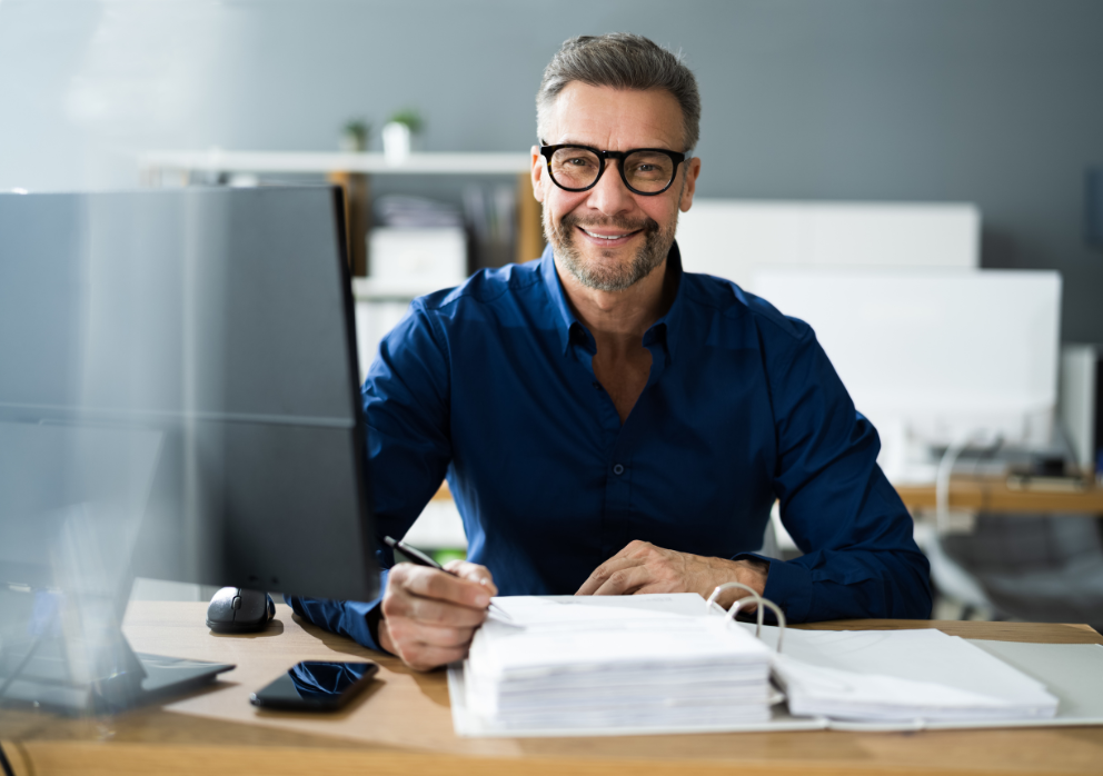 Mature worker at desk